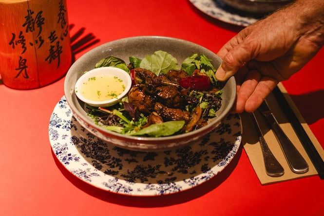 Plate of shaking beef on the table at Monsoon Poon.