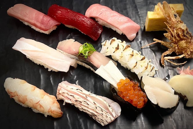 Bird’s eye view of plated raw sushi typical of what you would receive at Japanese restaurants in New Zealand.