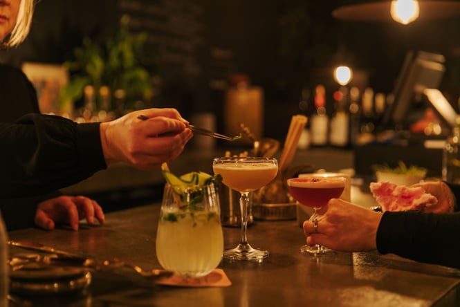 Three beautiful cocktails placed on bar top at Tiger Baby Bar in Christchurch