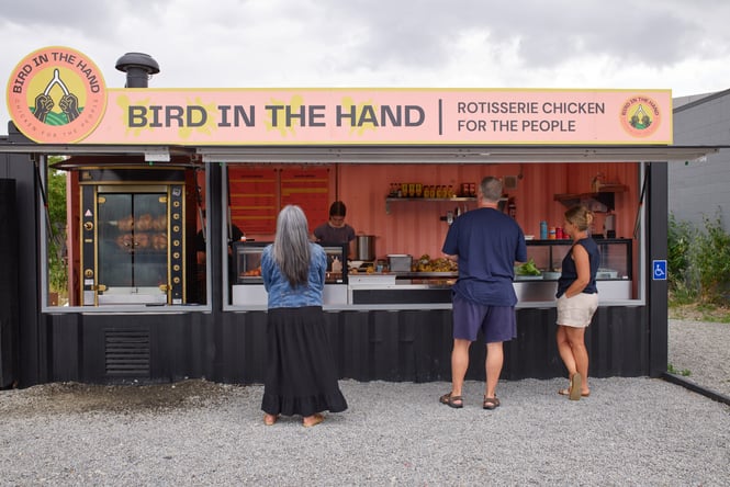 People lining up outside Bird in the Hand rotisserie food container in Christchurch