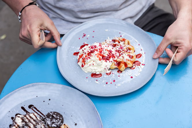 Two plates of waffles at Sweet As in New Brighton