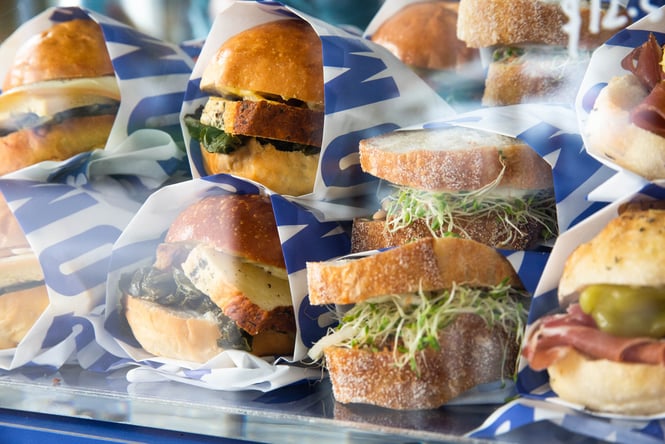 A variety of fresh sandwiches within the glass cabinet at Tom's in Christchurch.