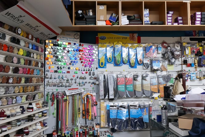 Shoe polishes and shoelaces on display inside Happy Feet New Brighton.