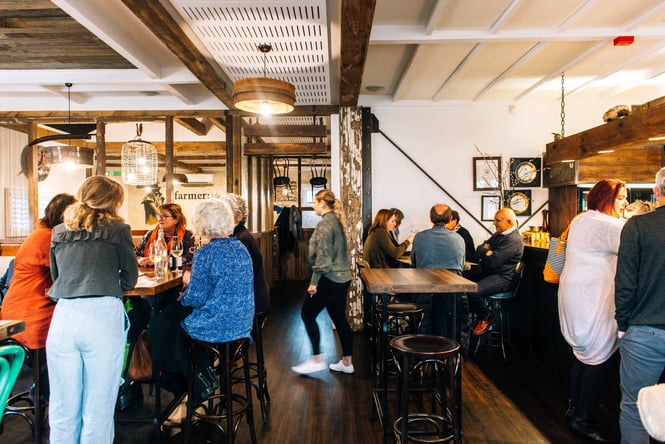 Diners sitting at tables at The Fat Farmer.