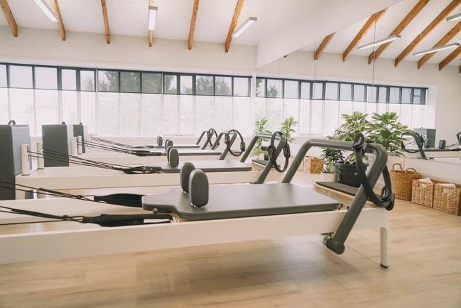 Reformer machines in a pilates studio.