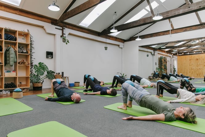 A pilates class in action at Well Studios.