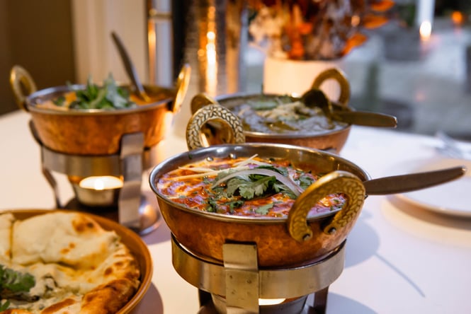 Curry in bowls on a table.