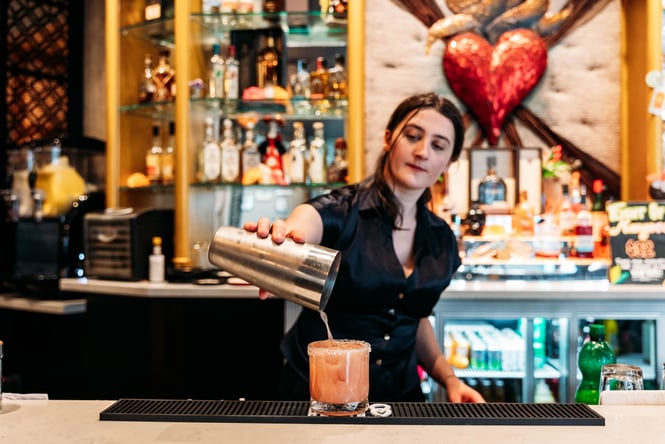 Bartender pouring a cocktail at Libre.