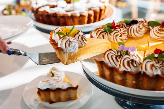A piece of lemon meringue pie being served at Pickle and Pie.