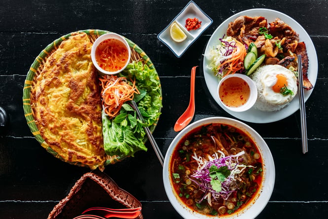 Flatlay of food dishes at Saigon '60s.