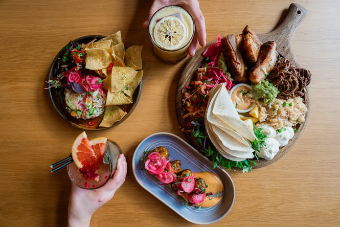 Mexican food and margaritas on a table at Muy Muy in Christchurch