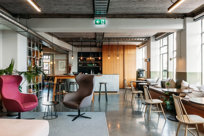 Panama Building interior with tables and chairs and reception desk.
