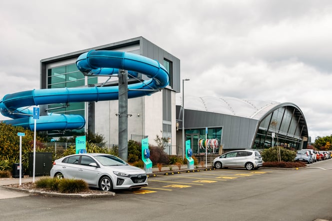 Building exterior and hydroslides of Coastlands Aquatic Centre.