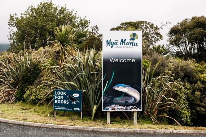 Welcome sign to Ngā Manu Nature Reserve and bush area.