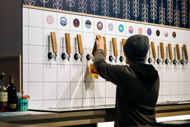 A man pouring beer.