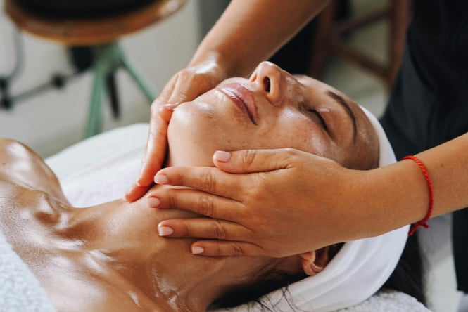 Women receiving a facial at day spa