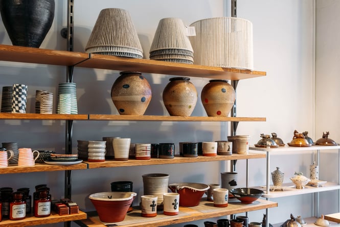 Ceramic cups on shelves inside Vessel in Wellington.