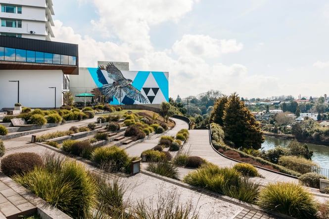 Public art on a wall next to the Waikato River in Hamilton.