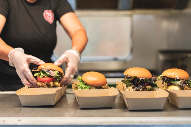 Burgers being prepared and assembled at East Cape Manuka Cafe.