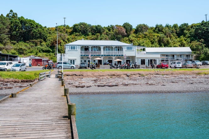 View of the Waihau Bay Hotel from the water.