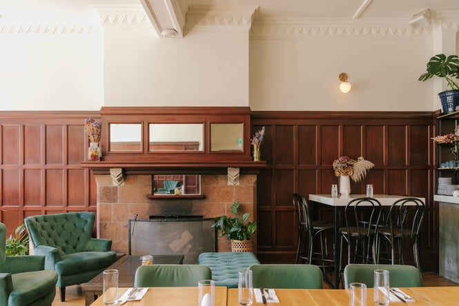 The green and brown interior of a cafe in Christchurch.