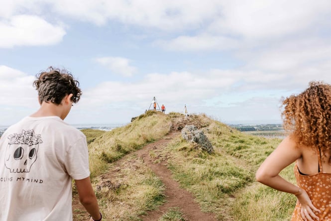 People climbing Mangere Mountain.