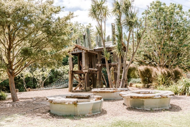 A wooden playhouse at Tōtara Park.