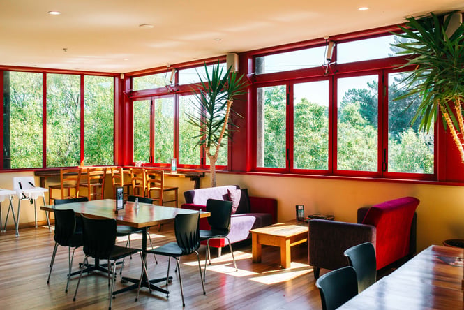 Tables and chairs inside LIght House Cinema.