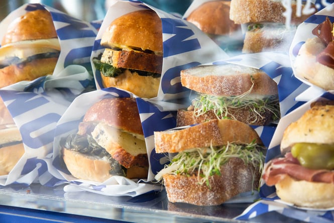 Close up of delicious sandwiches lined up in cabinet at Tom's in Christchurch