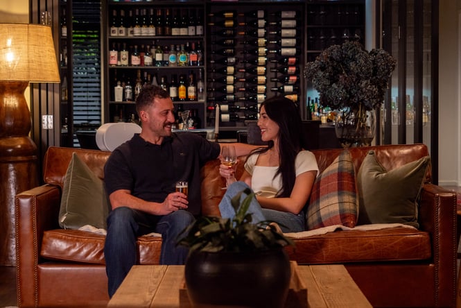 Couple sitting on a sofa.