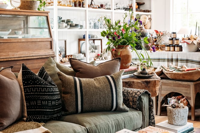 Sofa display with other homewares in the background at The Workroom.