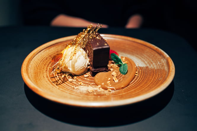 A close up of an Italian dessert on a table at night.