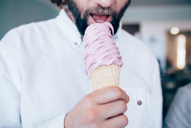 A man eating a real fruit ice cream.