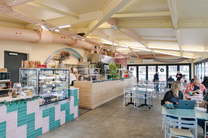 A large bright and sunny cafe space.