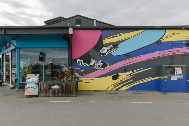 Colourful street art on the outside of a building.