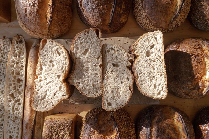 Freshly cut fluffy sourdough bread with air bubbles through it.