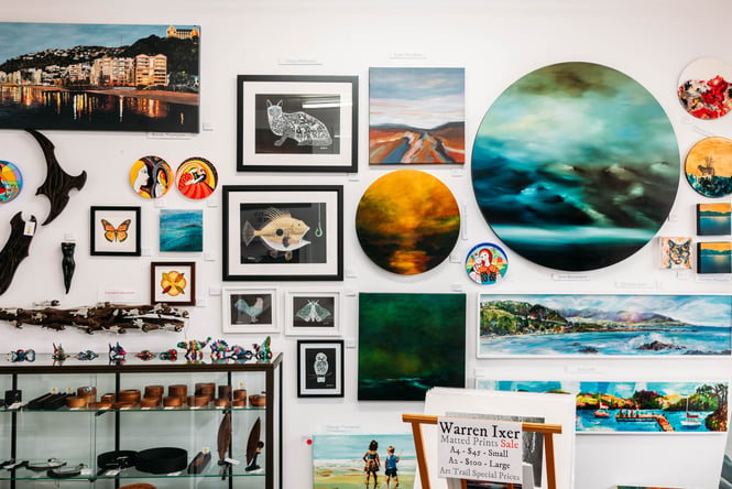 Various art pieces on the wall at Artel Gallery & Store.