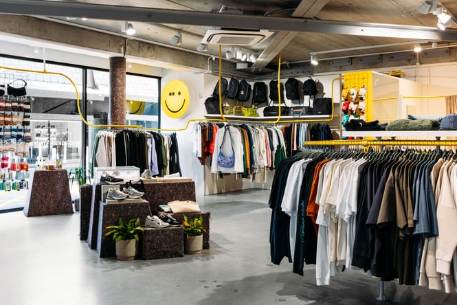 Clothing racks are arranged around the shop floor at Good As Gold.