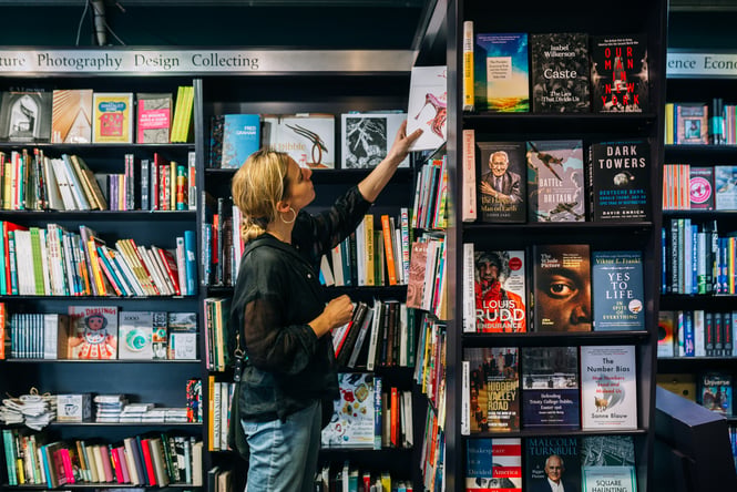 Customer browsing bookshelves.