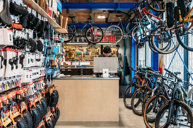Lineup of bikes in a workshop.