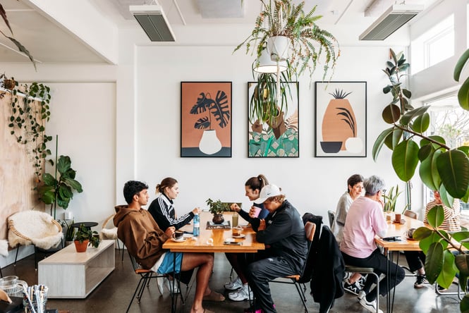 Customers sitting at tables at Coffee on Ascot.