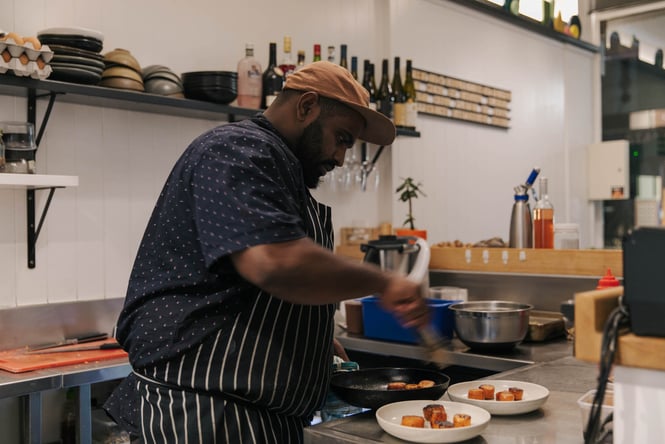 Shafeeq Ismail plating up in the kitchen at Story