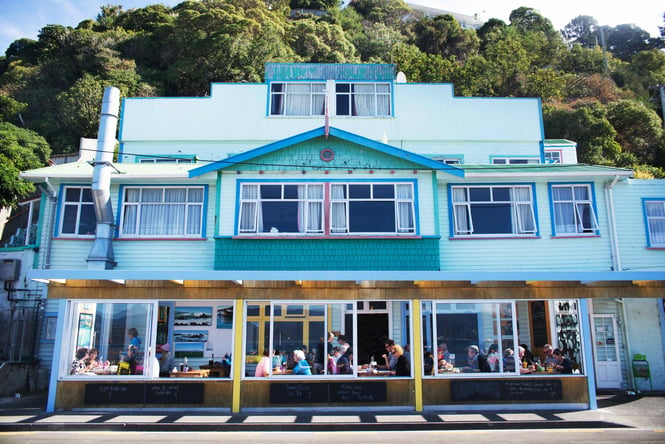 The blue painted exterior of the Scorch-O-Rama bar on a sunny day.