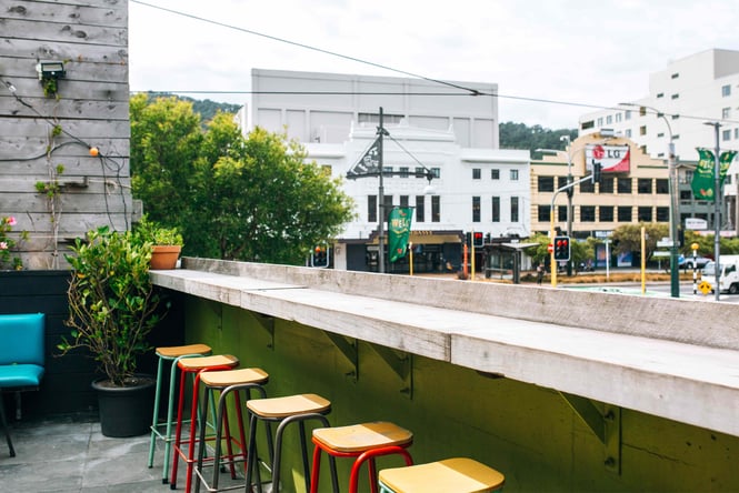 An outdoor bar overlooking a Wellington street below.