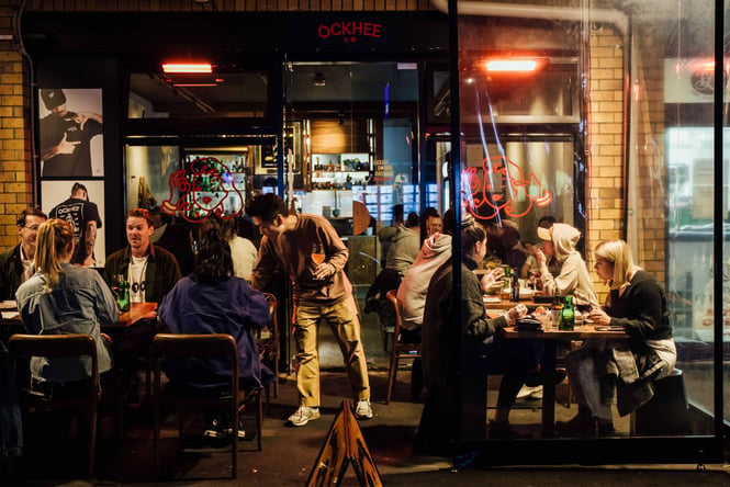 A busy outdoor setting outside Ockhee restaurant.