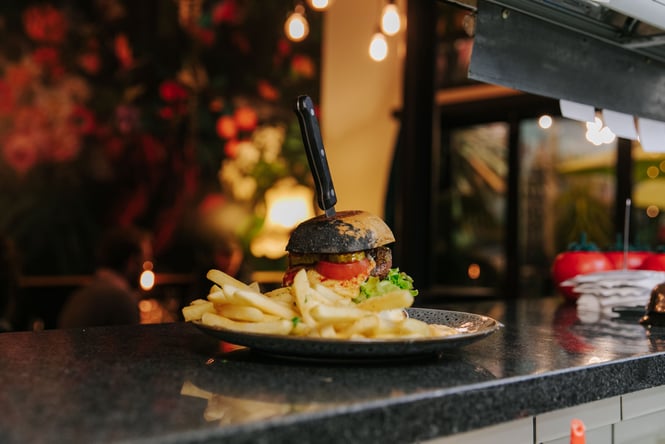 Burger on the pass at East St Café in Nelson.