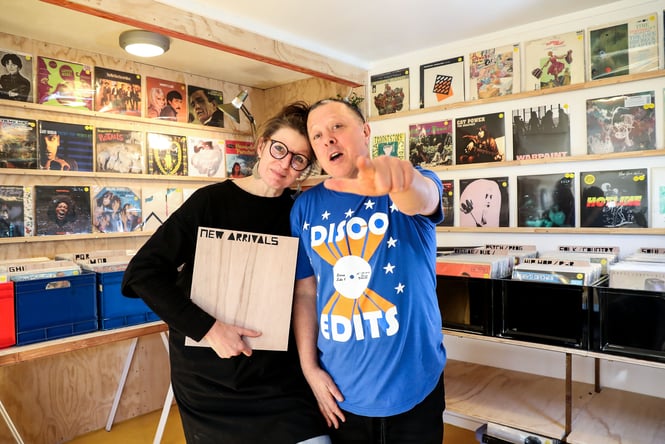 Owners of Family Jewels holding records.