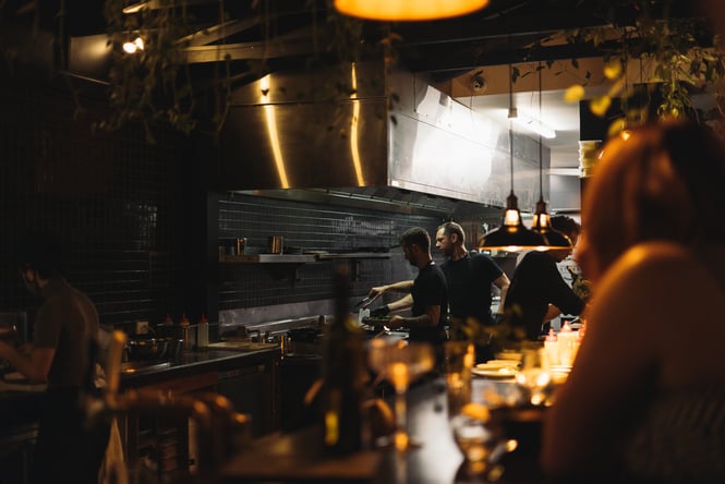 Two chefs working in the kitchen.