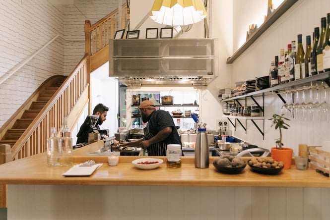 A chef working in the tiny kitchen at Story.