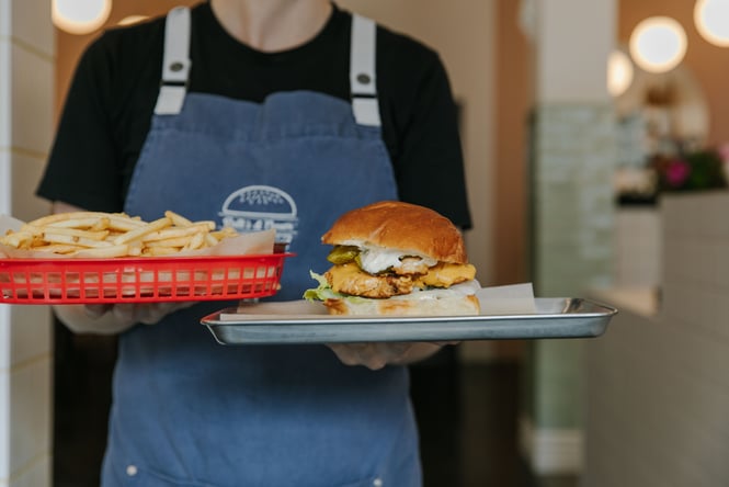Burger and fries being served at Patti's & Cream Diner.